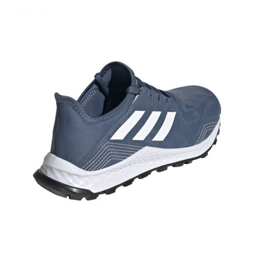 Blue and white athletic trainer with black sole and three white stripes on side
