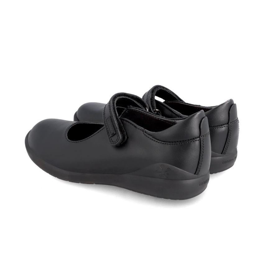 Pair of black leather Mary Jane school shoes with Velcro straps on white background