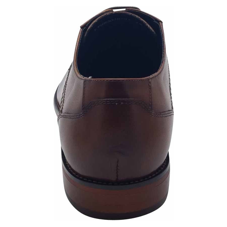 Rear view of a brown leather men's dress shoe with a wooden heel