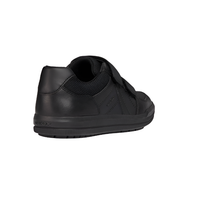 Black leather boys' trainer with velcro strap and textured sole, rear side view