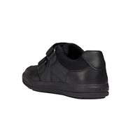 Black leather and mesh velcro school shoe, rear side view, rubber sole, closed heel.