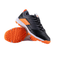 Black and orange athletic shoes with textured soles and lace-up design on white background
