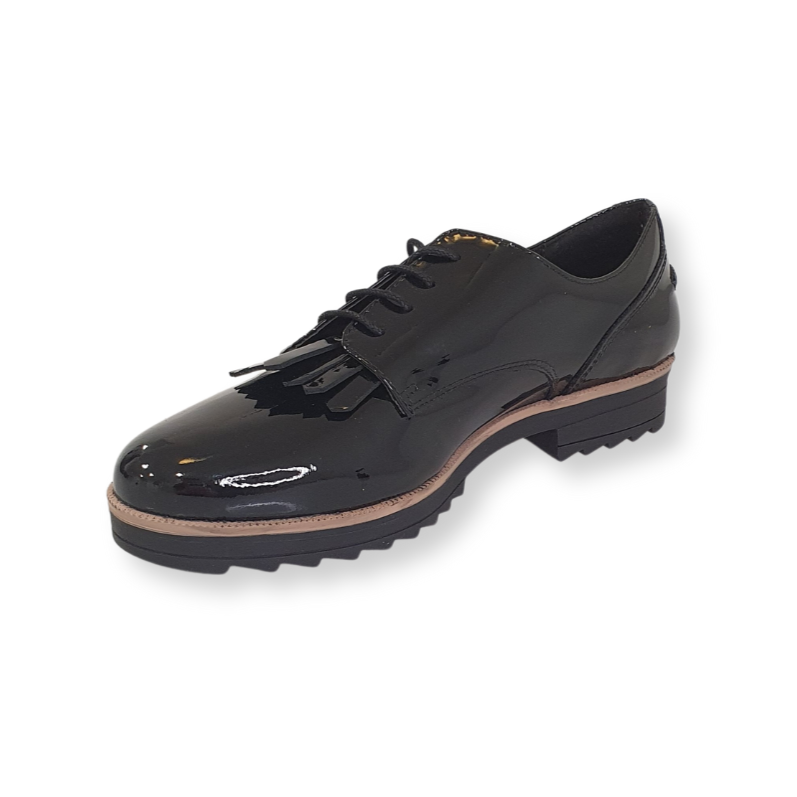 Black patent leather lace-up brogue shoe with fringe detail and chunky sole on white background