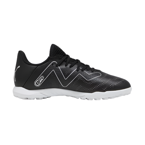 Black and silver turf football shoe with white sole, side profile, athletic footwear