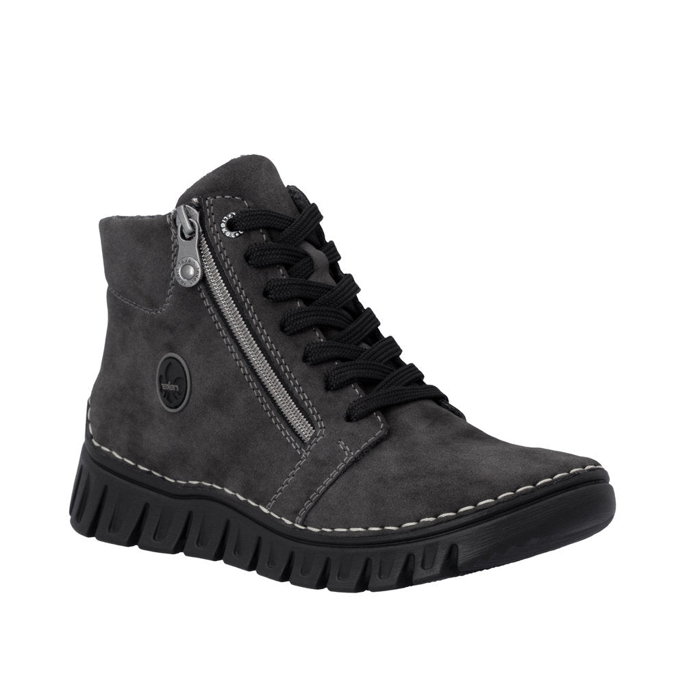 A dark gray suede ankle boot with black laces, a silver side zipper, and a chunky black sole, shown from a three-quarters angle on a white background.