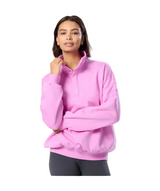 Person wearing a pink hoodie on a white background