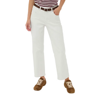 Person wearing white pants with a brown belt and brown shoes on a white background
