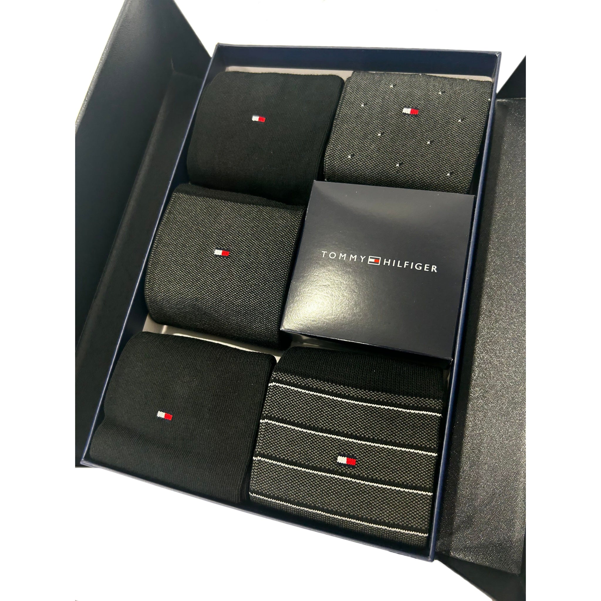 Gift box set of black men's socks with assorted patterns and logo branding