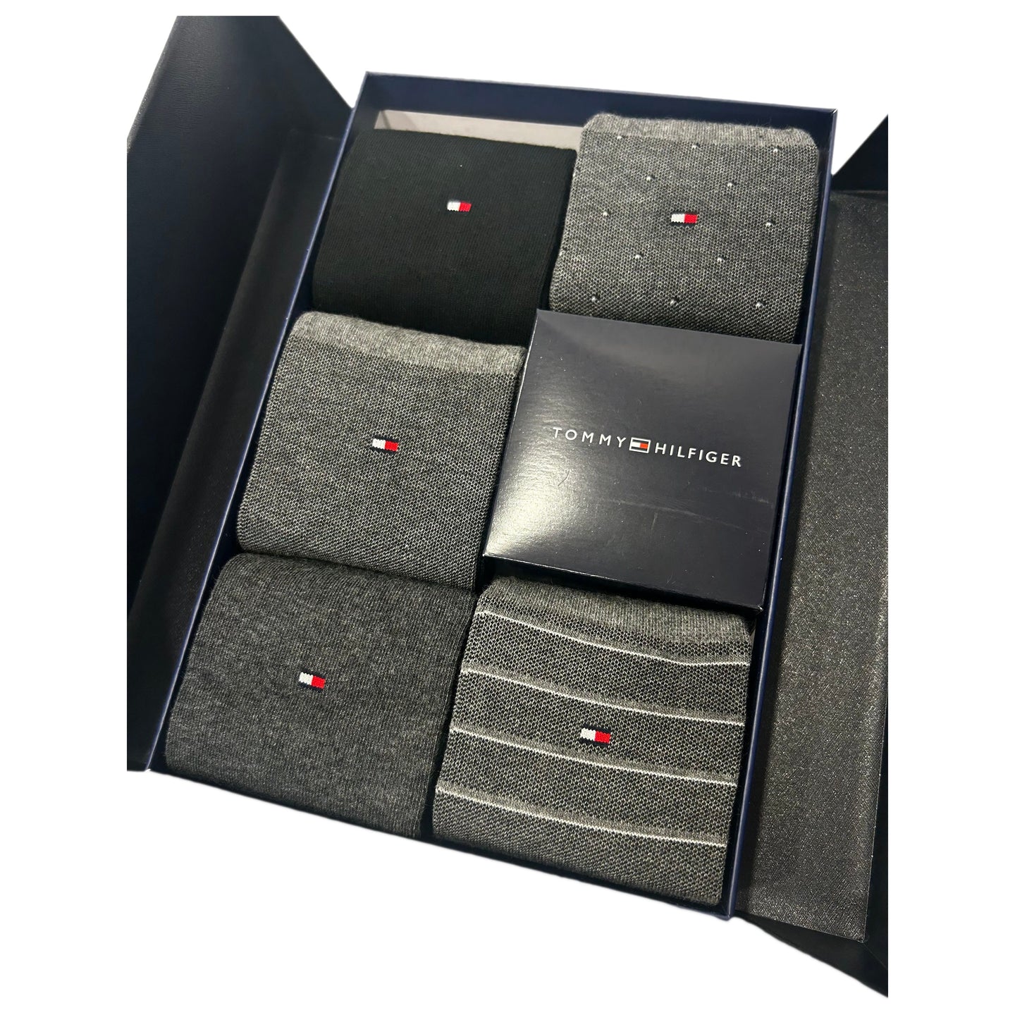 Gift box of assorted grey and black men's socks with small red and white logo details