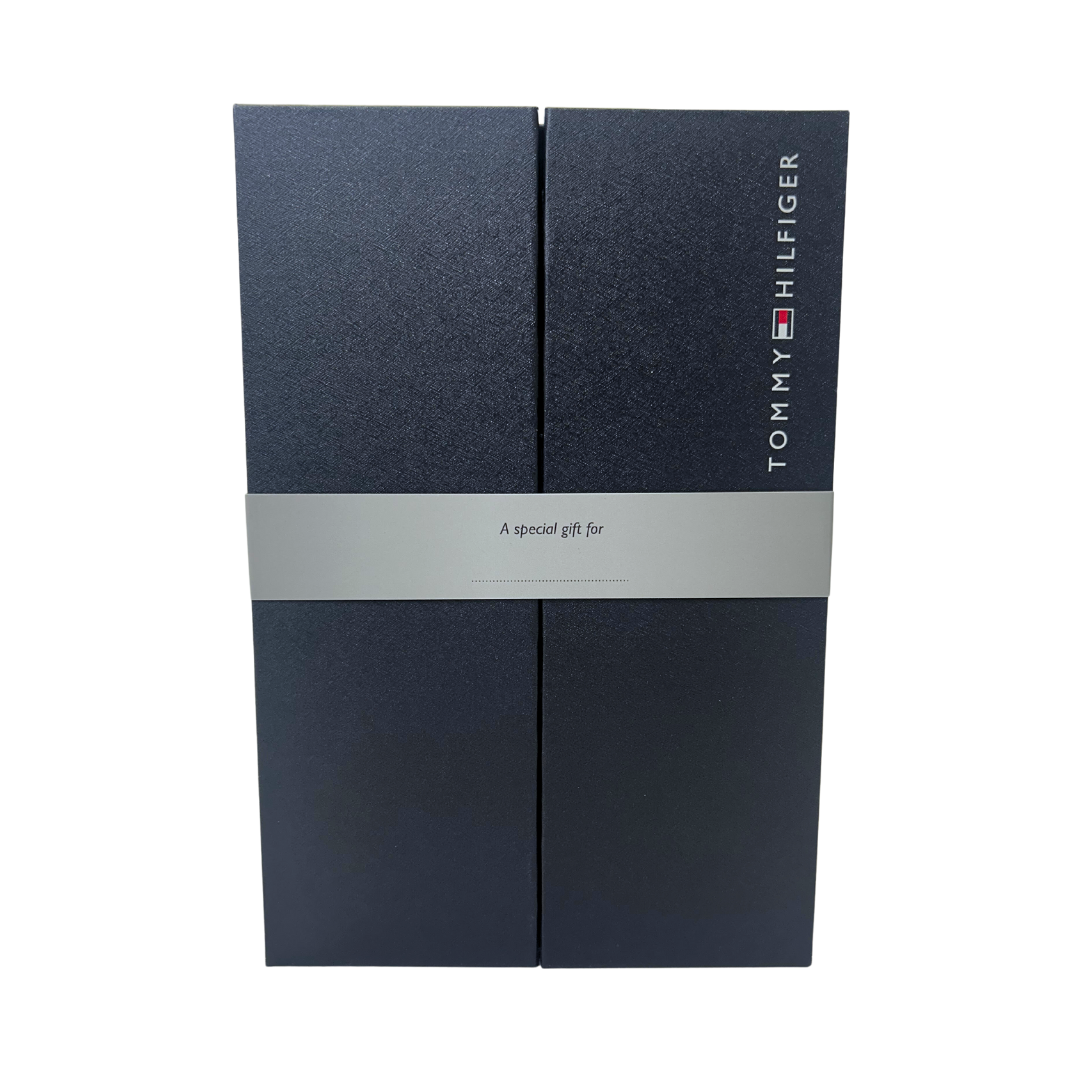 Navy blue Tommy Hilfiger gift box with silver band and vertical logo on front