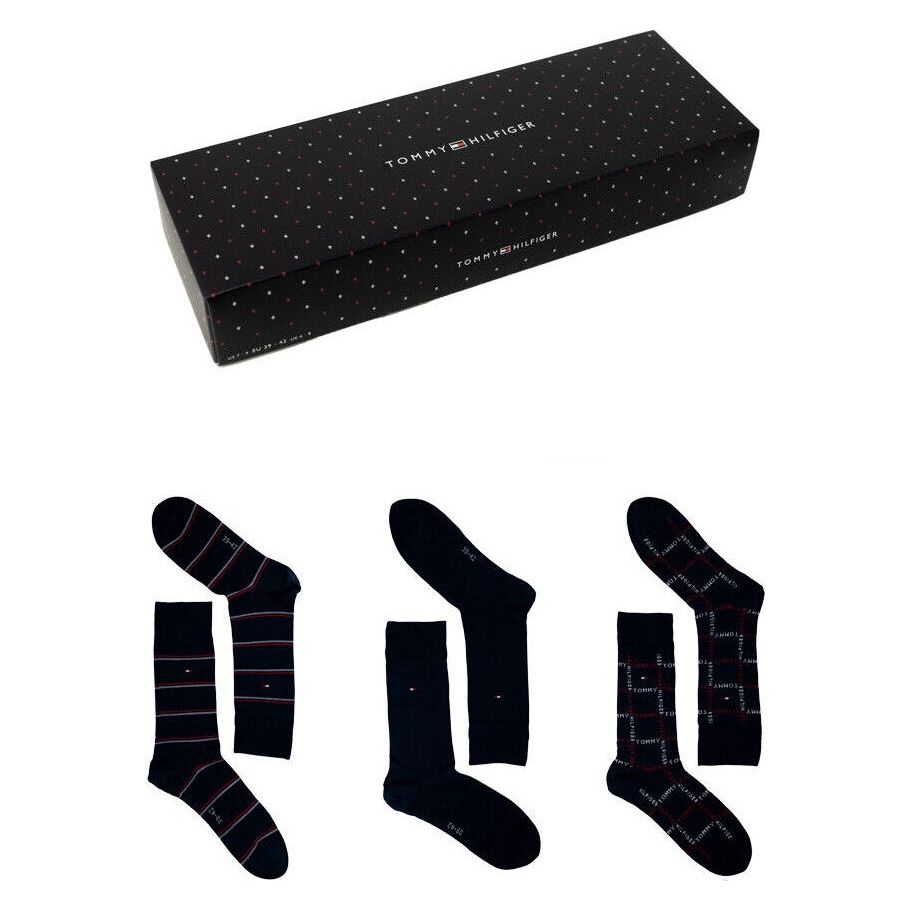 Gift box with three pairs of navy socks in striped, solid, and checked patterns.