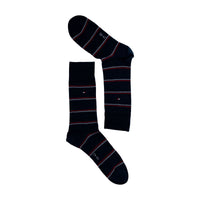 Navy blue striped socks with red and white accents, laid flat on a white background